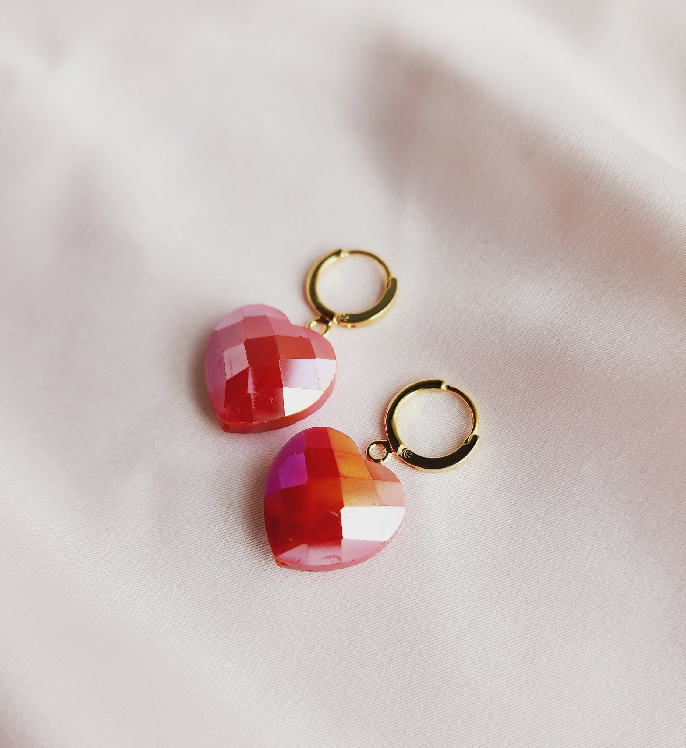 top view faceted heart earrings, gold hoops with hearts
