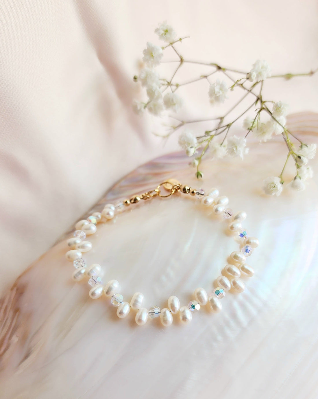 Top View Of a beaded pearl and ab iridescent crystal bracelet