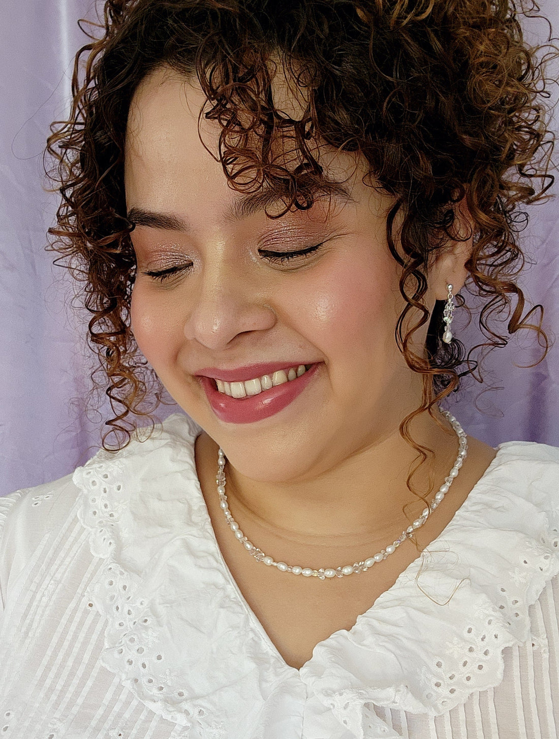 Front View Plus size model wearing a crystal and pearl necklace with matching earrings, complete bride jewelry set that is whimsical and romantic