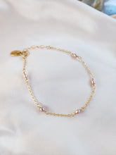 Top View Beautiful pink pearl linked chain bracelet in gold and sterling silver
