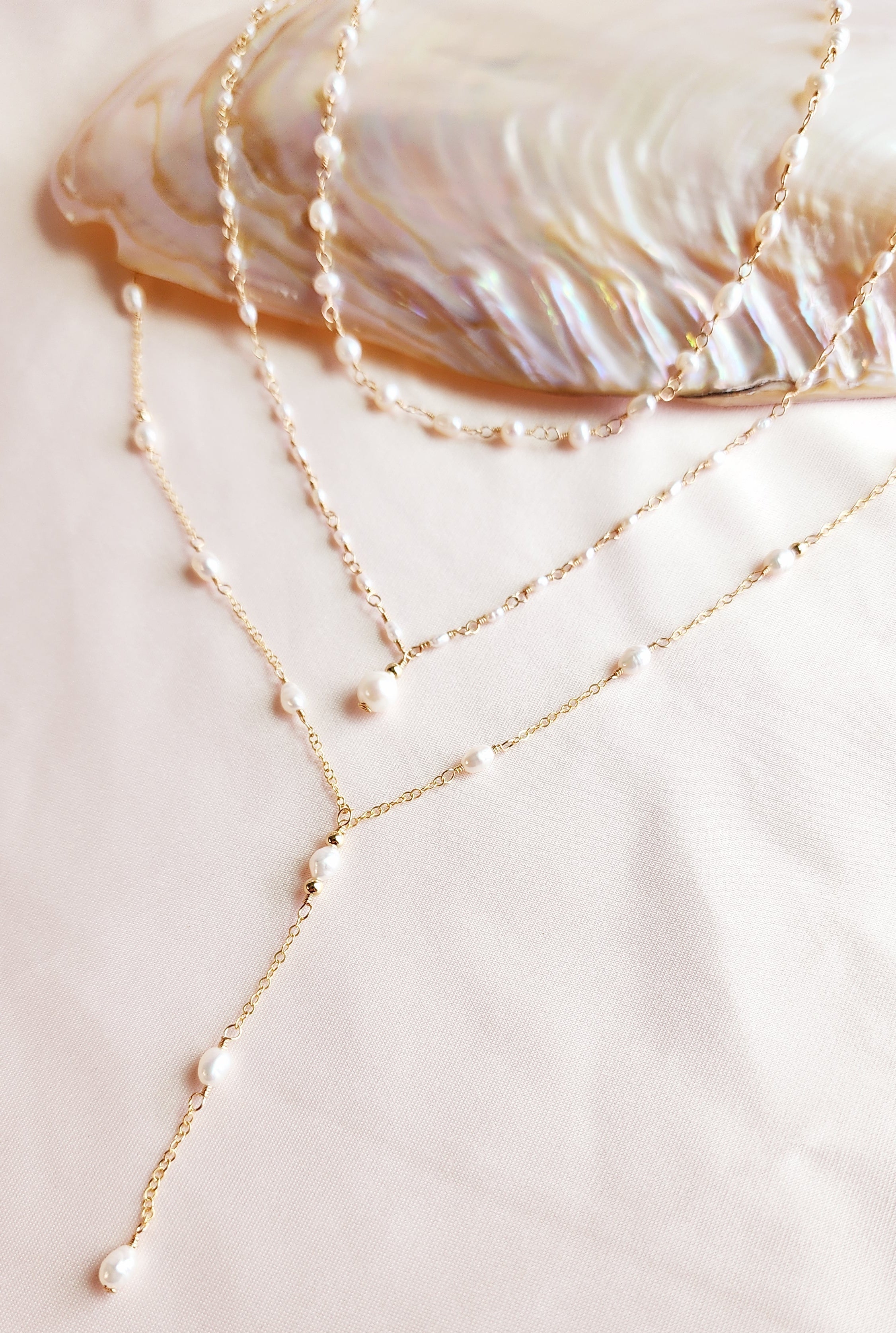 Side view of Layered pearl necklaces