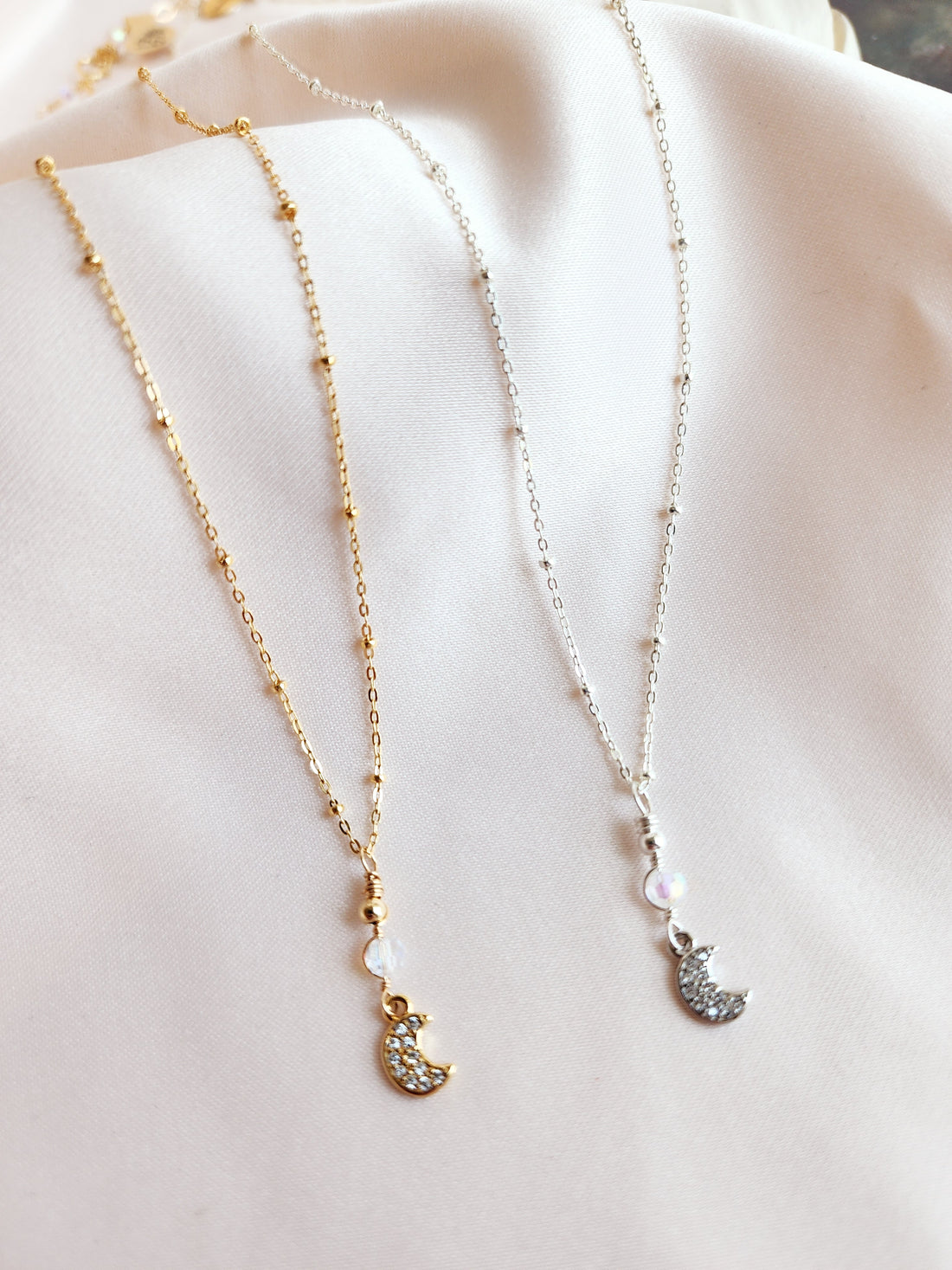 Crescent moon necklace made out of 14kt gold fill and sterling silver statellite chain