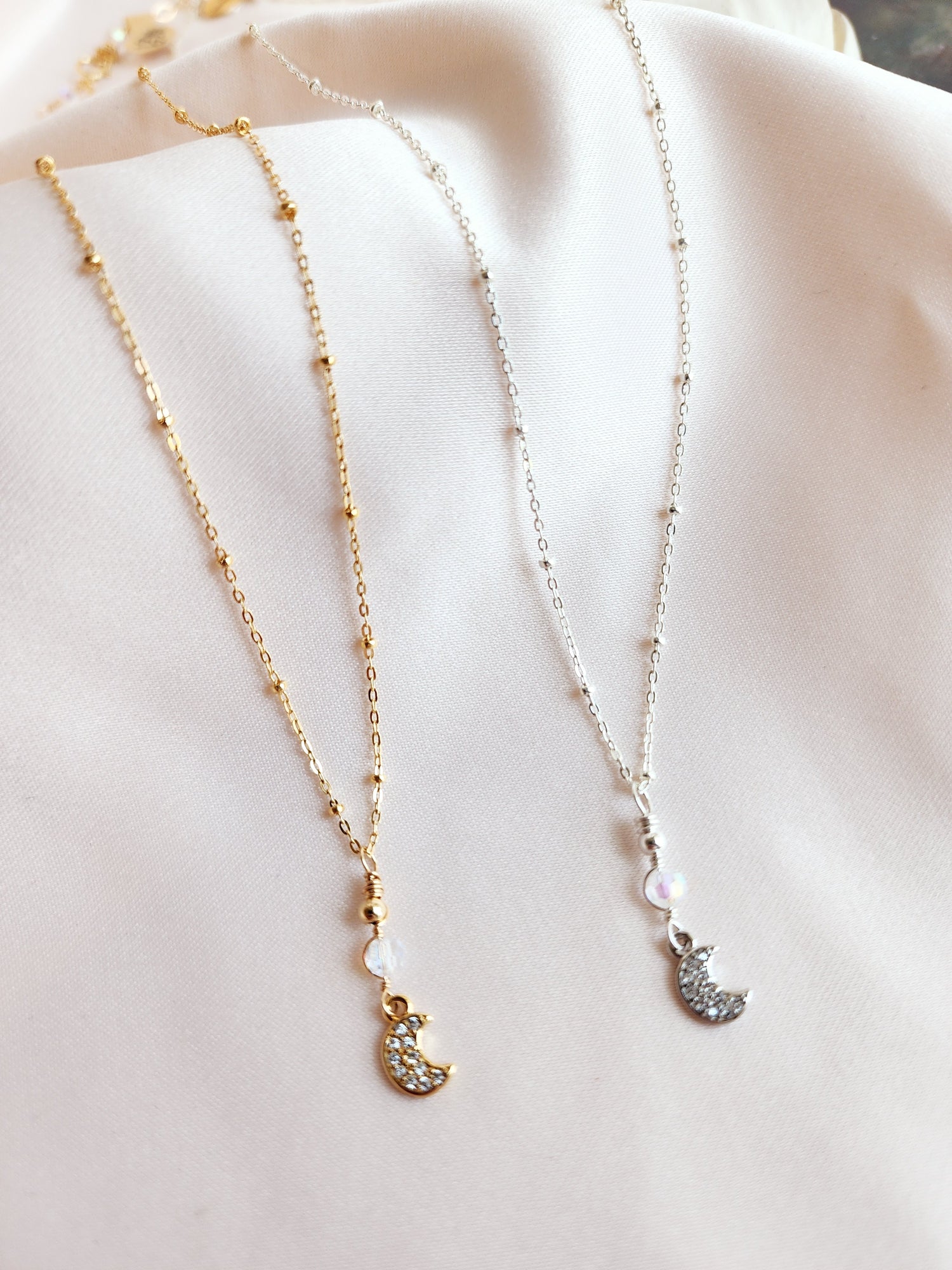 Crescent moon necklace made out of 14kt gold fill and sterling silver statellite chain
