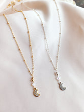 Crescent moon necklace made out of 14kt gold fill and sterling silver statellite chain