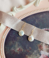 Front View peach color pearl earrings with 14kt gold fill hooks for everyday wear