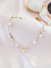 Top View dainty pearl and dangling crystal bracelet for brides and everyday women