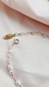  upclose picture of pearl heart bracelet so clients can see the brand logo tag 